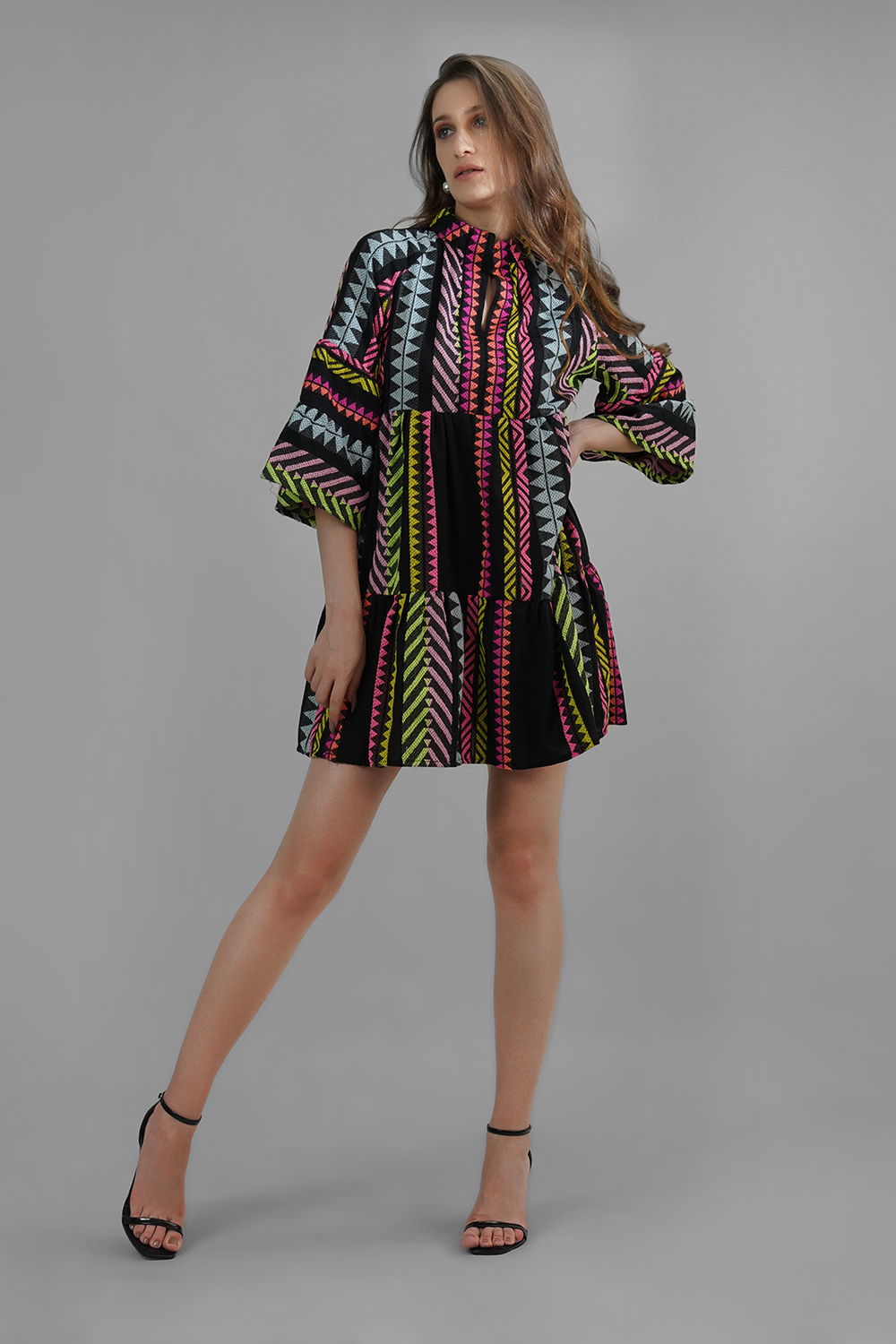 Model wearing handmade multicolor cotton lurex jacquard mini dress with flared sleeves