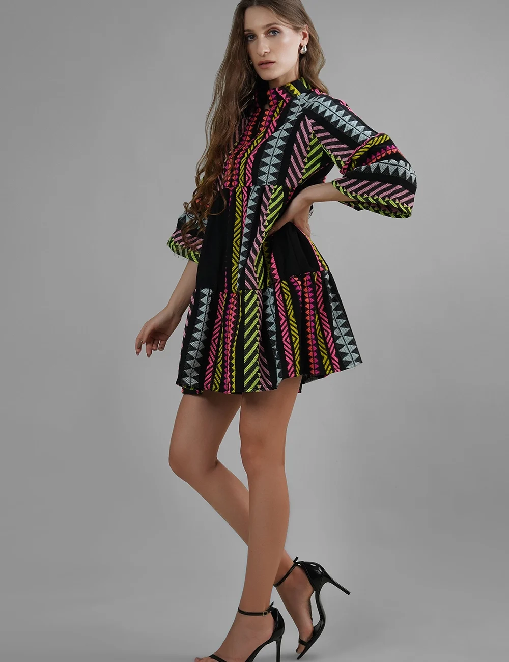 Model wearing handmade multicolor cotton lurex jacquard mini dress with flared sleeves