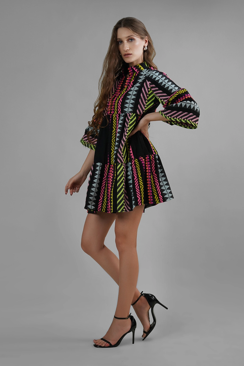 Model wearing handmade multicolor cotton lurex jacquard mini dress with flared sleeves
