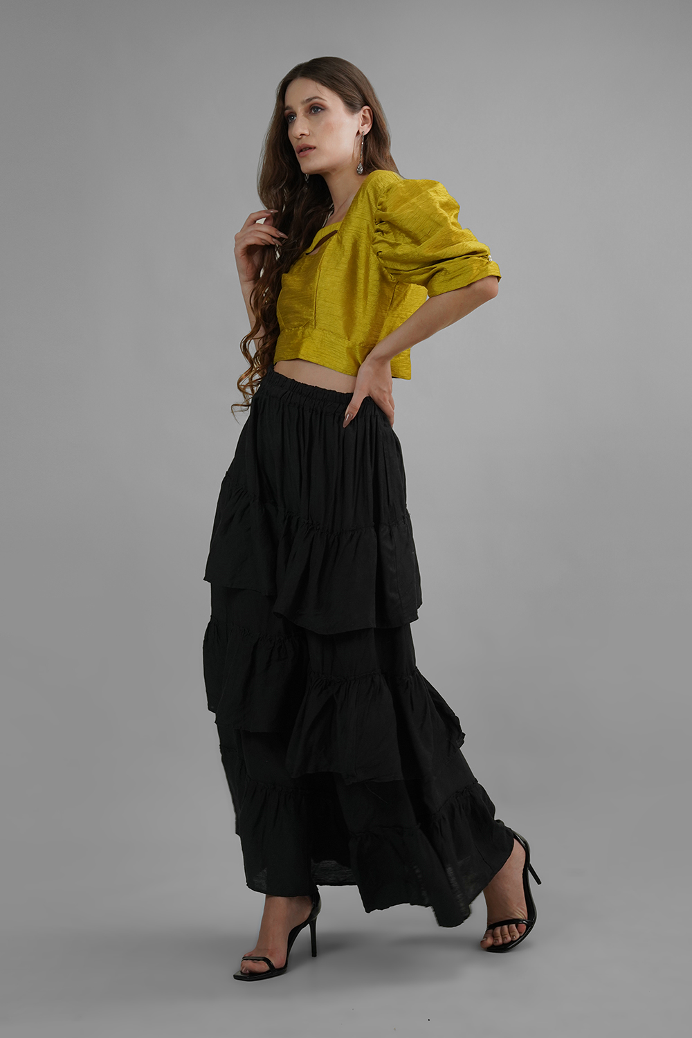 Model in mustard yellow puff sleeve Dhupian silk top with square neckline
