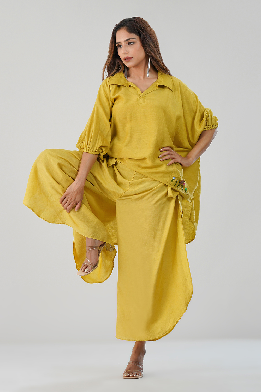 Model wearing mustard yellow cotton-linen co-ord set with embroidered pocket