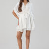 Model wearing off-white V-neck party dress in natural crape