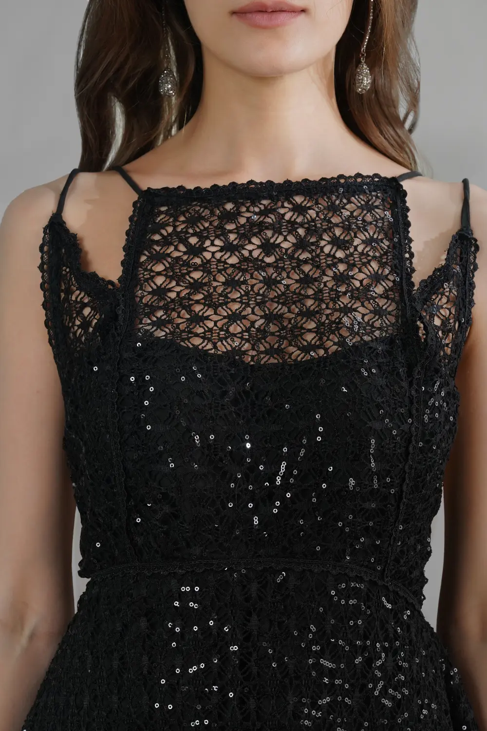 Midnight Noir black mesh party dress with sequin embroidery, square lace neckline and asymmetrical hem, worn by model