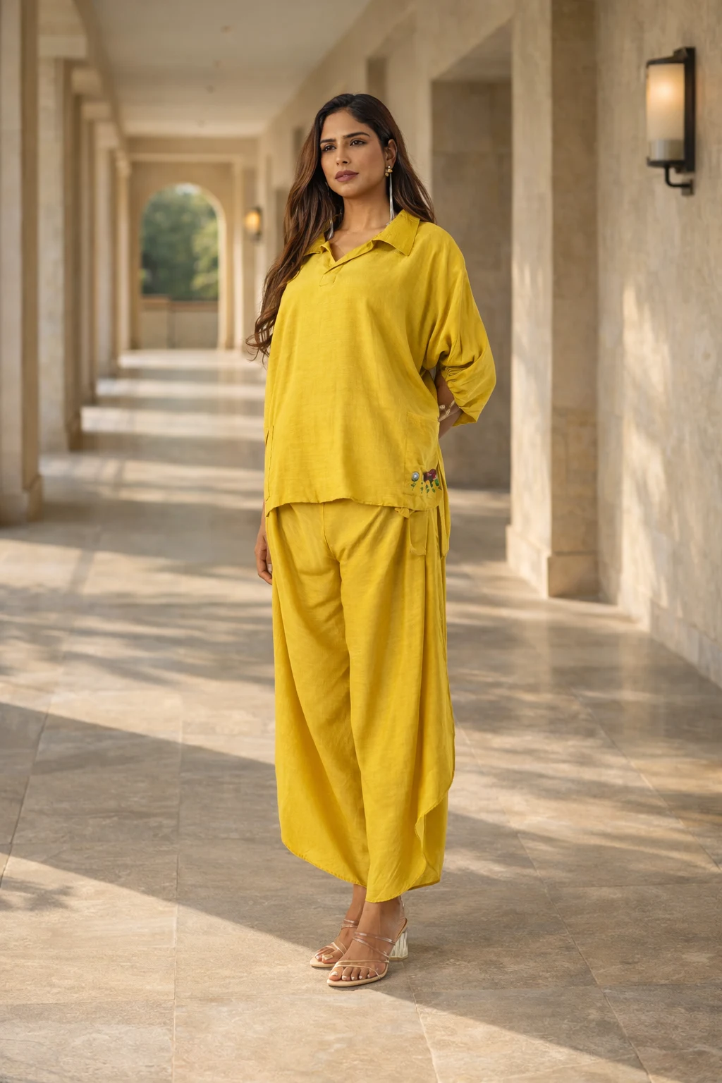 Model wearing mustard yellow cotton-linen co-ord set with embroidered pocket